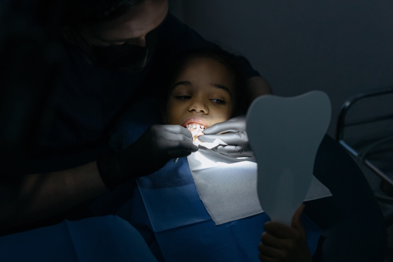 Pediatric dentist in Edinburg TX performing a procedure